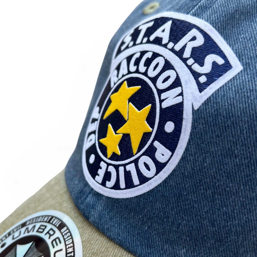 Gorra Resident Evil S.T.A.R.S. Logo Azul/Beige Tipo Deslavada